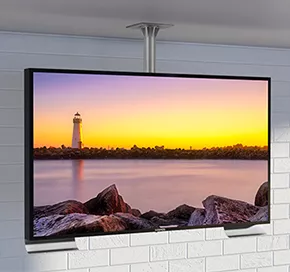 Ceiling-mount outdoor TV with a white brick walled background.