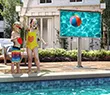 Thumbnail of an outdoor TV with the two kids enjoying a pool nearby.