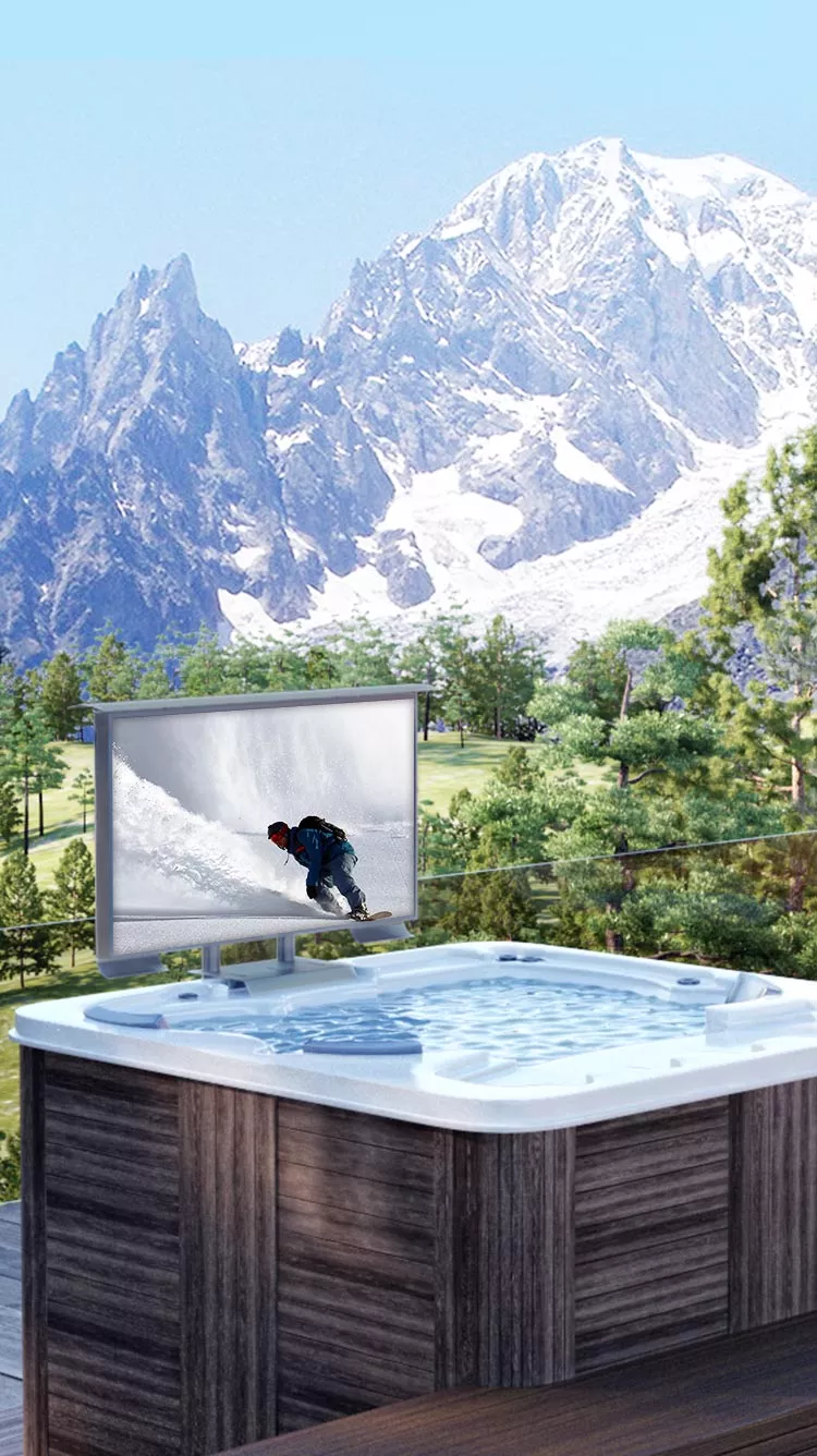 A beautiful scenario with a hot tub and an outdoor TV shows an ice-skating man.