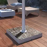 White river stone base mount outdoor TV with a solid steel pole on a wooden floor courtyard.