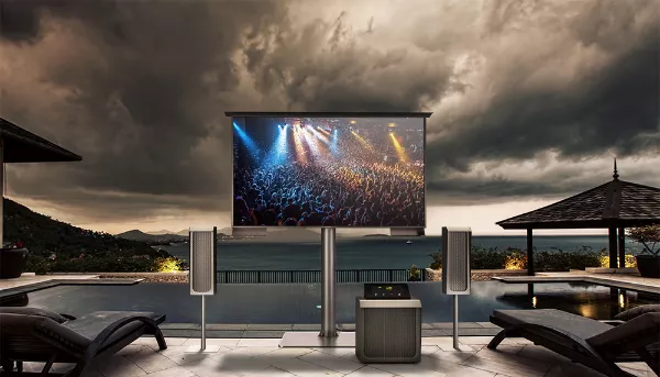 Self-stand outdoor TV with a sound-wave audio system in a sophisticated patio.