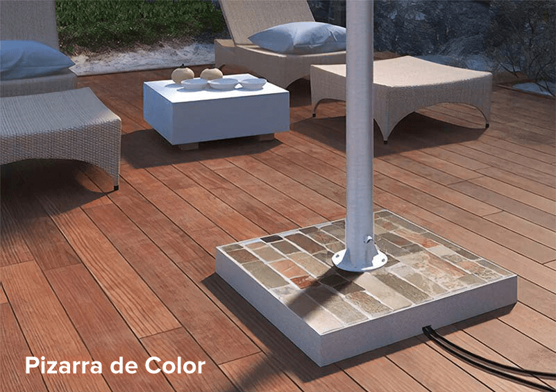 Colored slate stand for an outdoor TV on a wooden deck board floor.