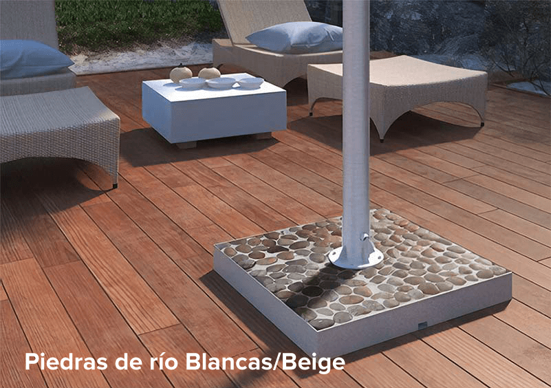 Beige river stone base for an outdoor TV on a wooden deck board floor.