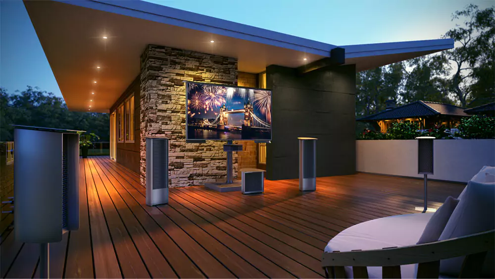 Outdoor TV with a stone base stand and a soundwave theater sound system in a courtyard.