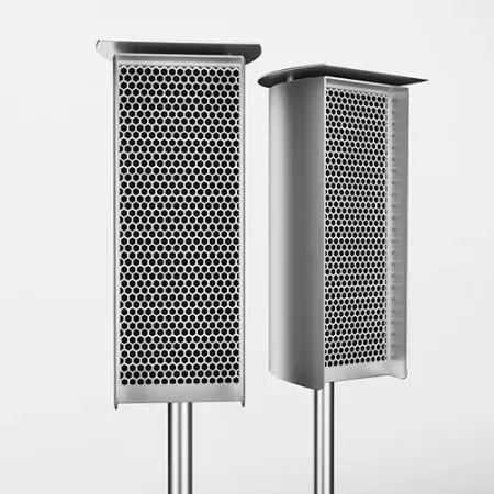 Two stainless steel speakers with a white background.