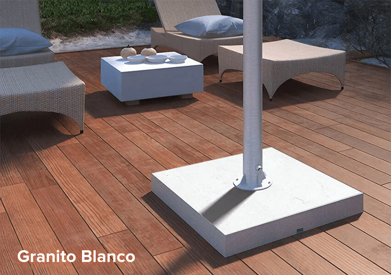 White granite stand for an outdoor TV on a wooden deck board floor.