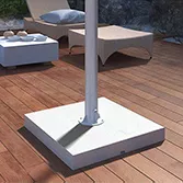 Outdoor TV stone base mount with a stainless bar and a white granite base on a veranda.