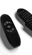 Thumb of two remote controls with built-in keyboard to navigate outdoor TV.