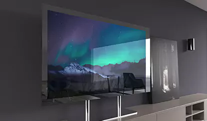 TV espejo sin marco montado sobre un escritorio sobre un mueble de cocina en una sala de estar simple.