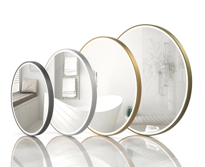 Four circular different sizes and colors lit mirrors reflecting on a white setting in Dubai.
