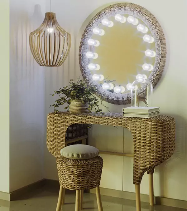 Hollywood mirror with an elipsa wooden pendant light and a vanity set made of rattan from Ajman.