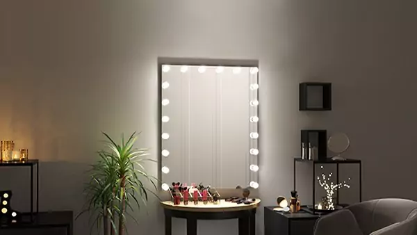 Tiny of wall mounted Hollywood mirror with vanity table accessories for makeup from Al Ain.