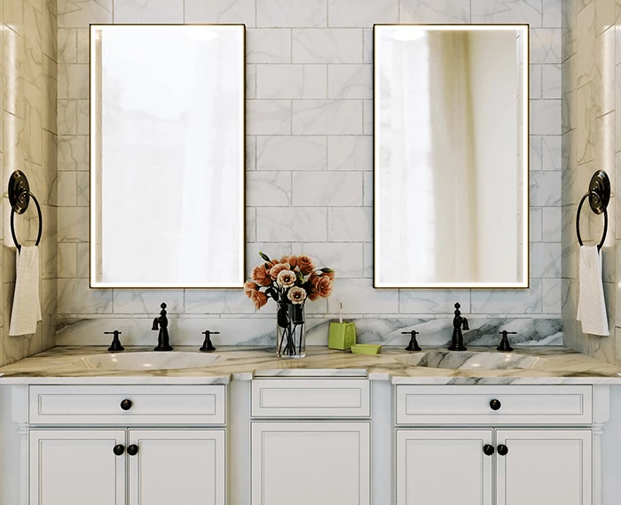Bathroom vanity with white cabinetry, marble countertop, and two boxy lighted mirrors in Al Ain.
