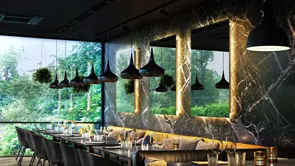 Three Grand Mirrors with backlights installed on the wall over an opulent dining table in Al Ain.