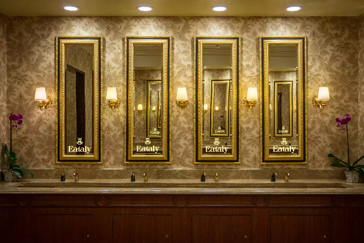 The elegant mirror with led light logo is affixed to a stylish wall from Bahrain.