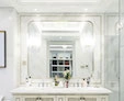 Preview of Abu-Dhabi unique cizzolo lamp paired with bathroom lights and mirror on a white wall.