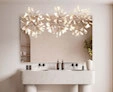 An icon of a bathroom sink with a wall mounted pavana lamp and a perfect fit mirror from Abu-Dhabi.