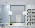 A bathroom including a blue mosaic wall, vigasio in a lit vanity mirror, and a basin from Al Ain.