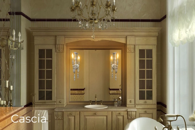 A versatile mirror has a Cascia lamp next to a crystal chandelier in an opulent bathroom from Ajman.