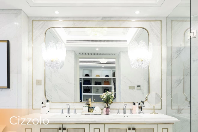 Dubai Cizzolo lamp adorns a rounded corner lighted vanity mirror set against a white background.