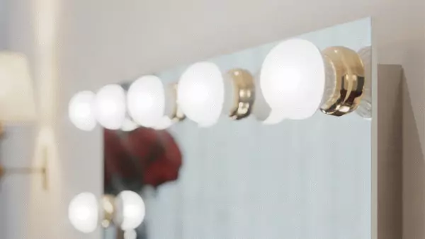  A unique mirror integrated inside a frosted light bulb with a gold ring from Dubai.