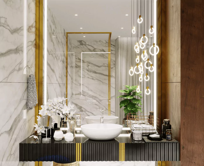 Elegant bespoke lighted mirror with a white orchid on a fancy sink in a luxurious bathroom in Oman.
