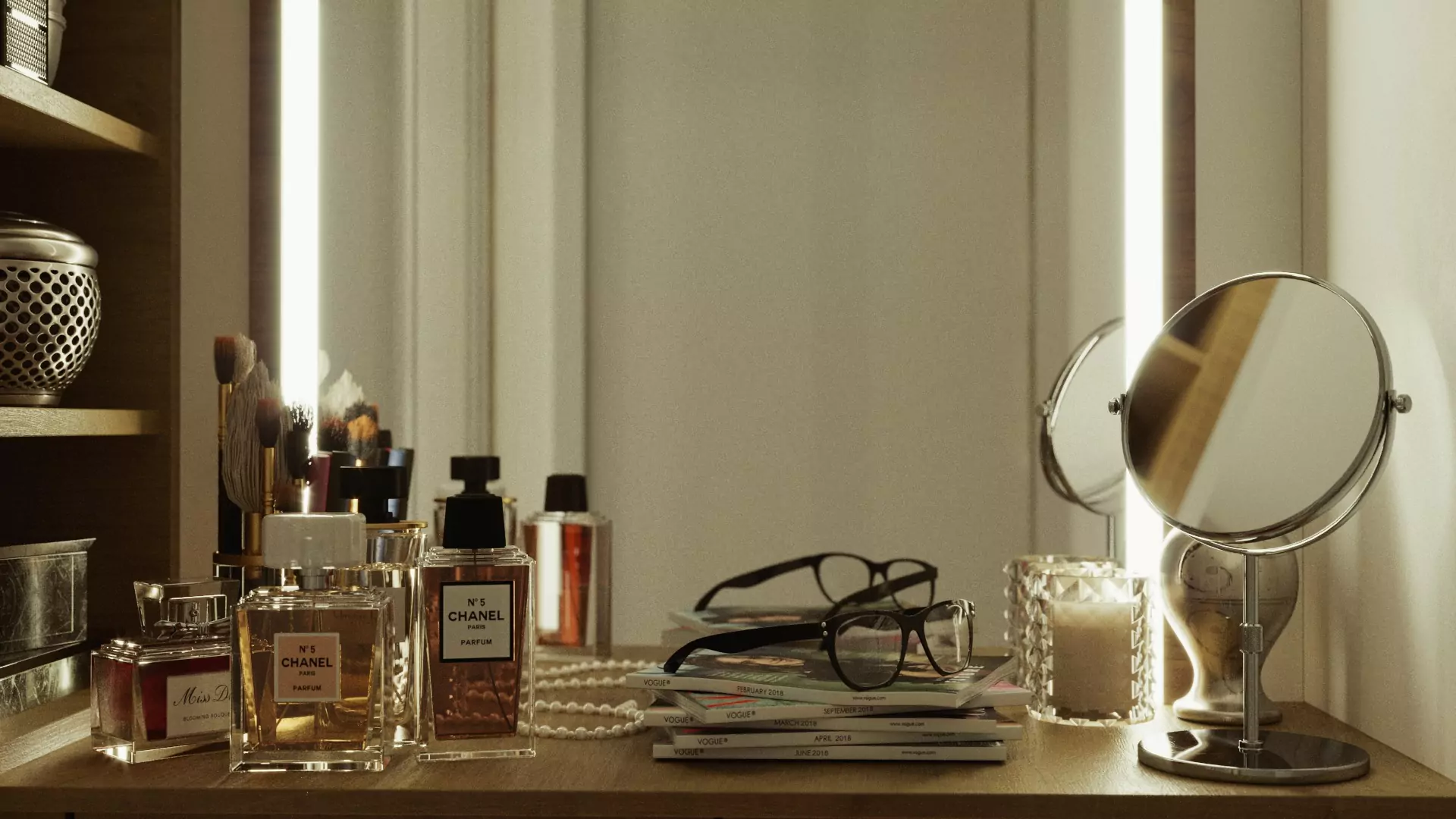 Vanity mirror with bottled perfumes, books, an eyeglass, and a candle on a wooden table in Kuwait.
