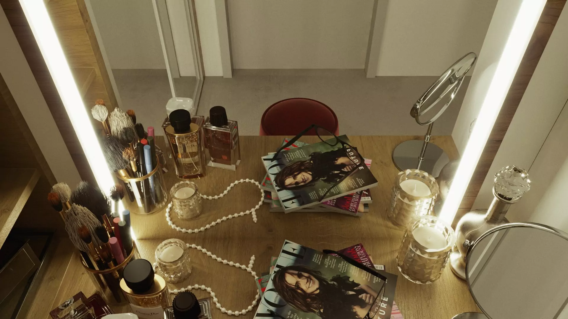 Oman top view of a lighted mirror with magazines, candles, and cosmetic materials on a wooden table.