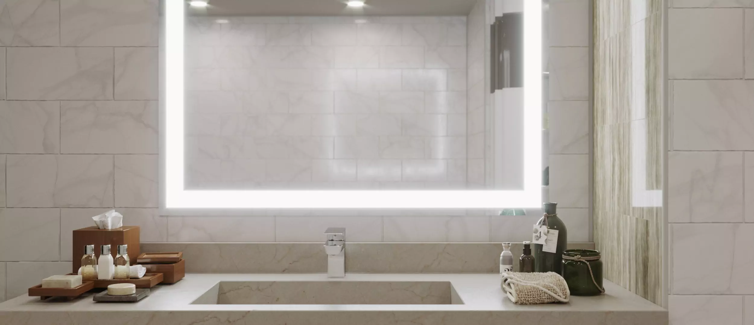 Lighted mirror inset on a wall with ceramic tiles and bathroom products on a marble sink in Oman.