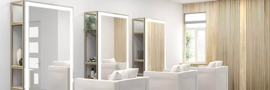 Evervue lighted mirrors attached on stainless steel shelves with a sofa chair at the front in Oman.