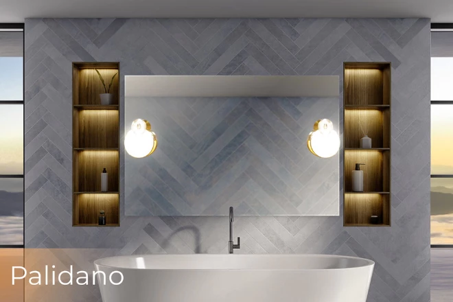 A vanity lighted mirror with Paladino lamp above a white tub is flanked by wooden shelves in Dubai.