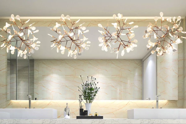Pavana Grand mirrors ambiance mounted on a concrete wall above two marble sinks in Sharjah.