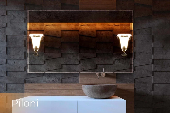 Above a sink bowl is a bespoke lighted mirror with a Piloni lamp is mounted on the wall in Sharjah.