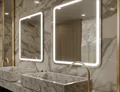 Icon of two made to measure Lighted mirrors mounted on a marble wall and two marble sinks in Qatar.