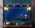 Icon of luzzara lamp within a wall mounted led mirror lamp over the pair of sinks above in Sharjah.
