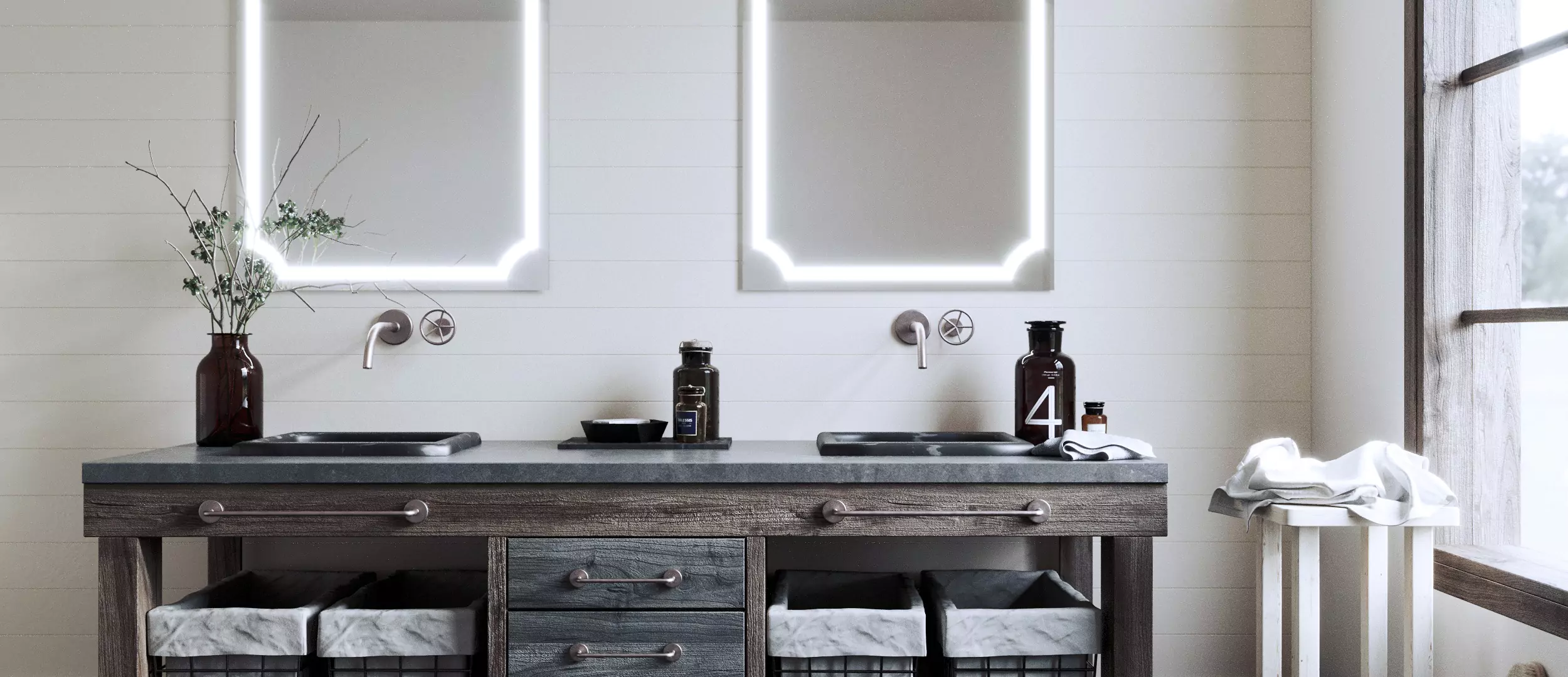 Two hotel magnifying mirrors inset in a white wall over the two black sinks in Sharjah.