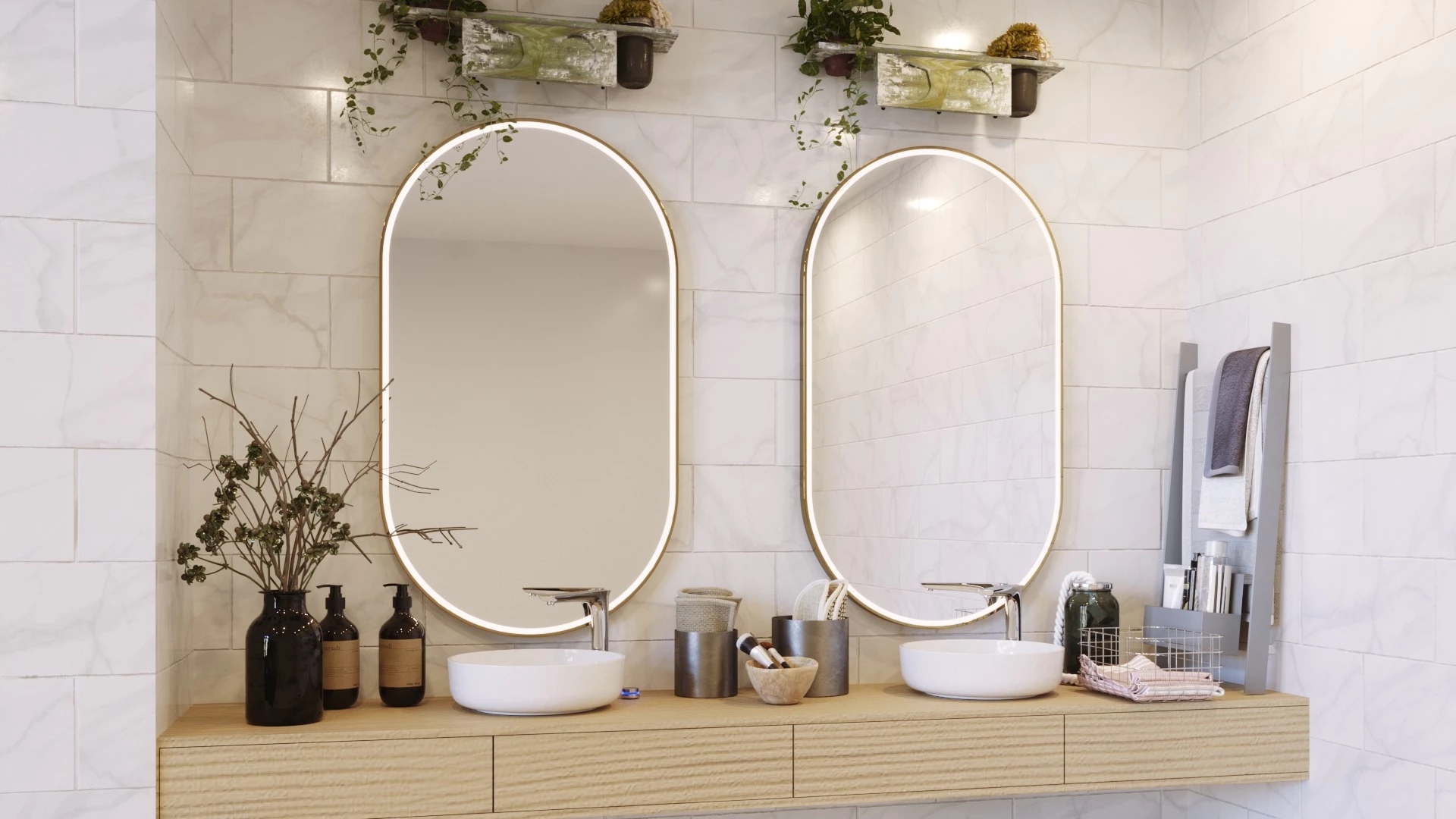 Light wood vanity topped with bowl sinks under oval lighted mirrors on a marble wall in Sharjah.