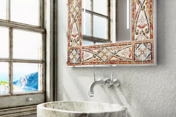 A ceramic framed mirror is fixed to the wall over a lone sink and a washbasin from Abu Dhabi.