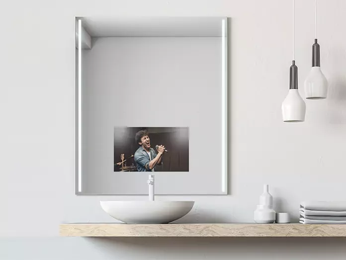 Mirror TV with cool light strips on either side and a white washbowl under a countertop table.