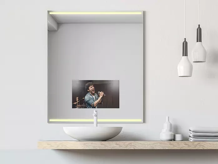 Philips mid-warm light mirror TV installed above a single white washbowl in a powder room.