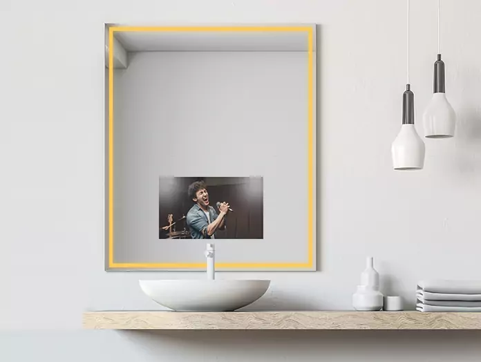 Philips warm light features on a mirror TV above a white basin with a pendant lamp on the side.