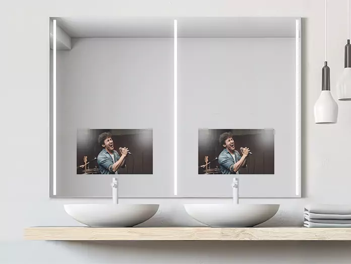 A mirror TV with three cool-light strips, installed above the white double sinks.