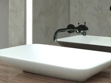 Custom cut out mirror with a white single basin.