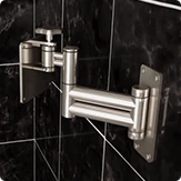Aluminum swivel bracket BR-120 for a bathroom smart touch TV on a black tiled wall.