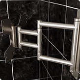 Bathroom TV Ocea Pro aluminum swivel bracket BR-160 on a black porcelain tiled wall.