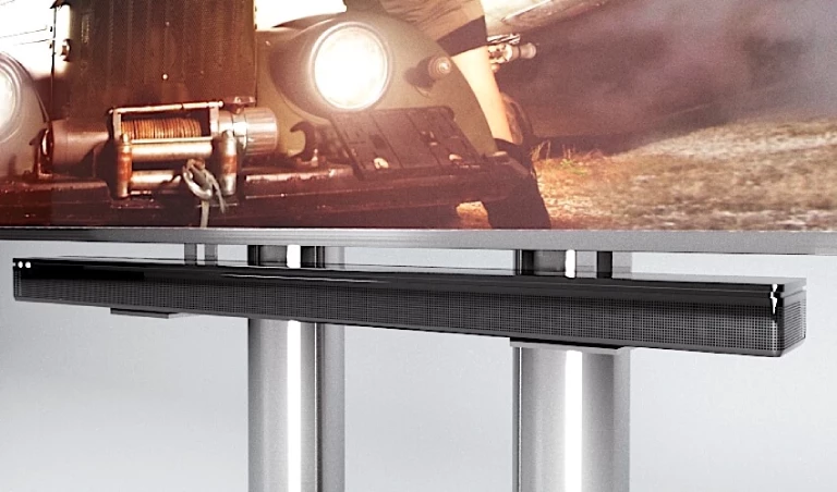 Modern soundbar mounted below a cinematic TV.