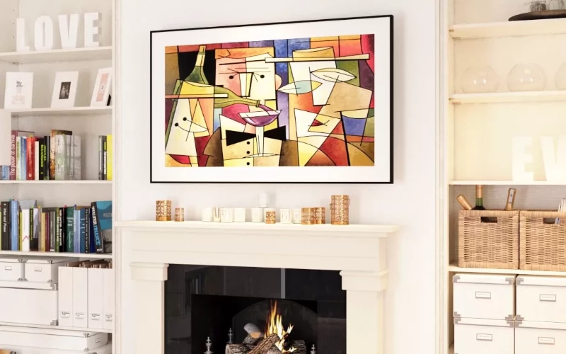 Cozy fireplace lounge area featuring a vibrant smart TV with geometric painting display.